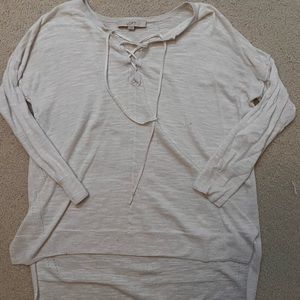 White thin knit sweater with tie on the neck